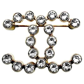Spilla Chanel Coco Mark in oro champagne