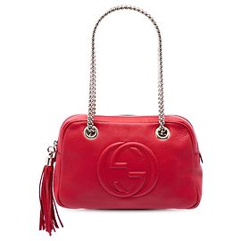 Borsa a tracolla Gucci Soho con catena e zip in pelle di vitello rossa