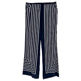 Pantalones anchos a rayas Totême en seda blanco y negro