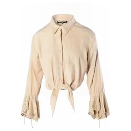 Blusa Roberto Cavalli in camoscio beige con bordo in pizzo e fiocco anteriore