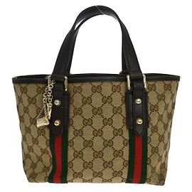 Gucci Jolicoeur Pochette GG Canvas and leather
