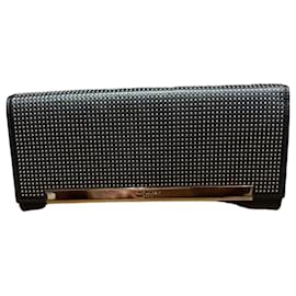 Clutch in pelle borchiata nera Saint Laurent