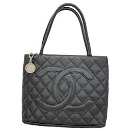 Borsa Tote Chanel in pelle di vitello martellata nera