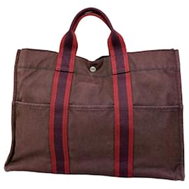 Hermès Bolso Tote vintage Hermes de lona rojo borgoña plata