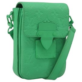 LOUIS VUITTON Lock Vertical Wearable Wallet M81525