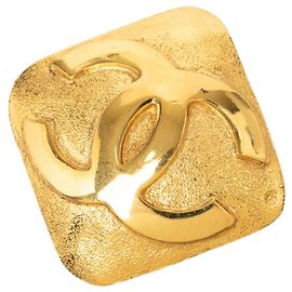 Spilla Chanel CC placcata oro con diamanti