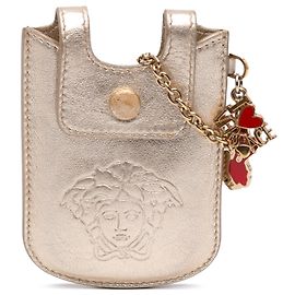 Porta labiales Versace de piel metalizada dorada La Medusa con cadena