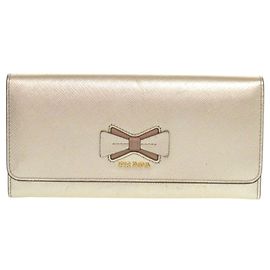 Cartera larga de piel dorada Prada 1MH132 Ribbon Saffiano Fiocco