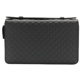 Monedero GUCCI Microguccissima de piel negra