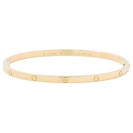Pulsera Cartier Love Charm en oro amarillo de 18K