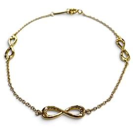 Tiffany & Co Bracciale con charm Tiffany Infinity Endless in oro giallo