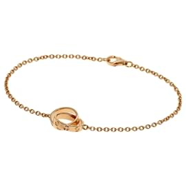 Bracciale Cartier Baby Love con ciondolo in oro rosa 18K