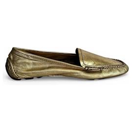 Coach goldfarbene Lederloafer