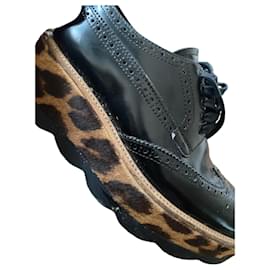 Prada Black leather and leopard print platform oxfords