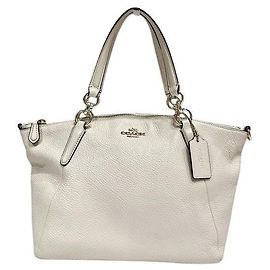 Borsa Coach in pelle martellata