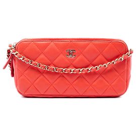 Clutch Chanel CC matelassé in pelle d'agnello arancione con doppia zip e tracolla a catena