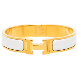 Bracciale Hermès Clic H Narrow in smalto dorato PM