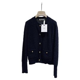 Prenda de punto Dior en Tweed Negro con Botones de Perlas Doradas
