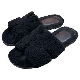 Hermès Pantofole Izmir in shearling Nero