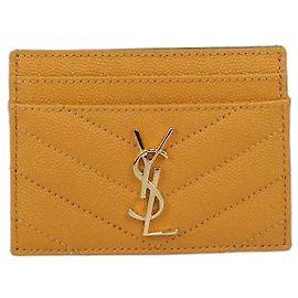 Tarjetero Saint Laurent Cassandre de piel acolchada amarilla