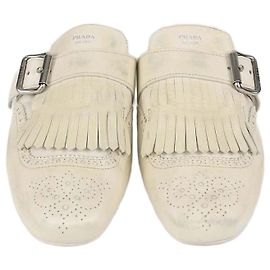 Mules Shuffle in pelle Off White con frange Prada