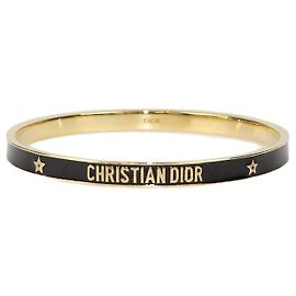 Christian Dior Armreif aus lackiertem Metall in Schwarz/Goldfarben