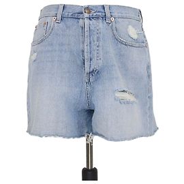 Pantalones cortos Gucci de denim azul desgastado con bordado de gato