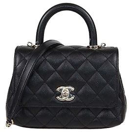 Mini borsa Chanel Coco Top Handle in pelle caviar matelassé nera