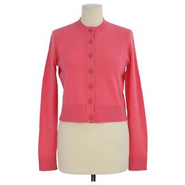Cardigan Chanel in cashmere rosa, girocollo, maniche lunghe e bottoni CC