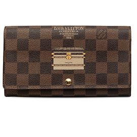 Cartera larga Louis Vuitton Limited Edition Damier Ebene Trunks and Locks Sarah Wallet Marrón