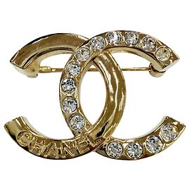 Spilla Chanel A24P in metallo Coco Mark con strass