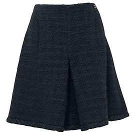 Gonna a trapezio CHANEL in lana bouclé nera con bottone CC - FR 48 usata