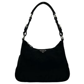 Bolsa Prada em nylon Tessuto e couro com logo triângulo em metal