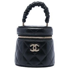 Mini Vanity Case Chanel in Lambskin Matelassé Nero con Manico Arricciato