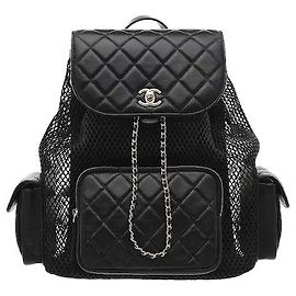 Chanel's signature quilting pattern harmonizes with mesh material for a distinctive three-dimensional feel and lightweight fit. Sophisticated chain strap and logo detailing add the house's