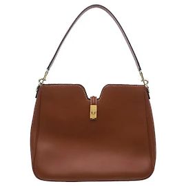 Céline The flexible silhouette delivered by soft, natural calfskin material harmonizes with the brand's distinctive turn-lock closure for an elegant mood. Generous storage space and a comfortable shoulder