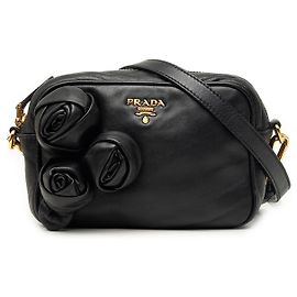 Borsa a tracolla Prada in nappa nera con rosetta