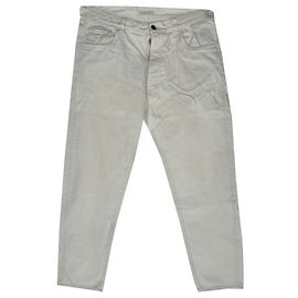 Jeans a gamba dritta in cotone bianco con patch logo Prada