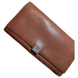 Autre Marque Cartera Lancaster de cuero marrón con cierre metálico