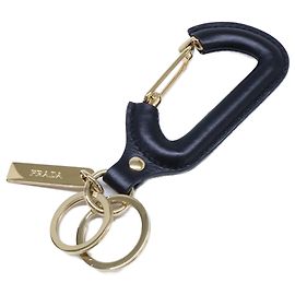 Llavero de piel Prada en negro y dorado