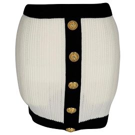 Minigonna in maglia a coste bicolore con bottoni decorativi Balmain in viscosa bianca