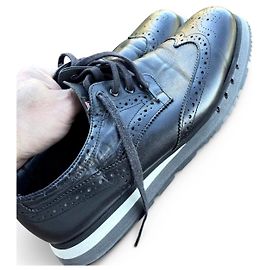 Prada Black leather brogues with platform sole