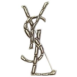 Spilla Yves Saint Laurent Cassandre effetto coccodrillo