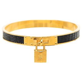 Hermès Kelly Armreif aus Leder schwarz und gold