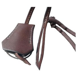 Hermès Clochette und Lederriemen in Braun