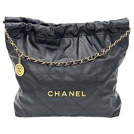 Chanel Schwarz-goldene Metalltasche von