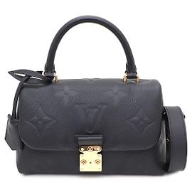 Louis Vuitton mala de mão e de ombro Madeleine BB Monogram Empreinte com alça superior e transversal