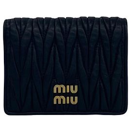 Miu Miu Tarjetero mini bi-fold de piel negra