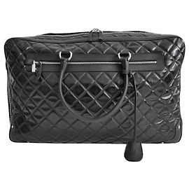 Mala de viagem Chanel Timeless acolchoada