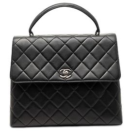 Sac à main Chanel Kelly Top Handle en agneau matelassé noir